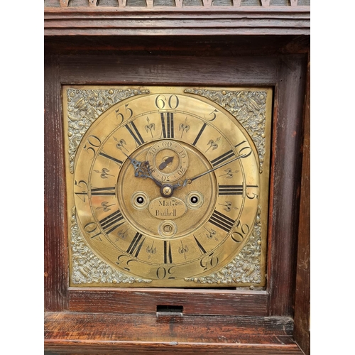 1142 - A George III oak and walnut crossbanded eight day longcase clock, the 12in square brass dial in... 