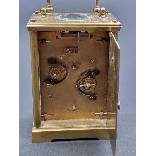 1149 - An antique brass carriage clock, with alarm, height including handle 14cm, (alarm faulty), with wind... 