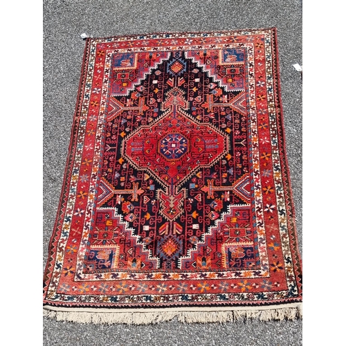 1156 - A Persian rug, having central diamond medallion; together with a small Persian floral rug, largest, ... 