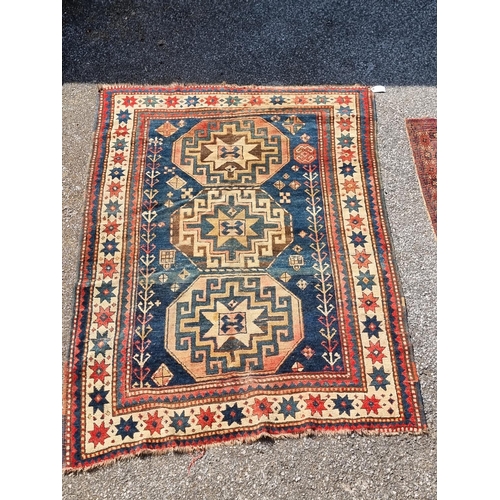 1157 - A Caucasian rug, having three central medallions, with star decoration to borders, 175 x 139cm.... 