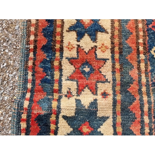 1157 - A Caucasian rug, having three central medallions, with star decoration to borders, 175 x 139cm.... 