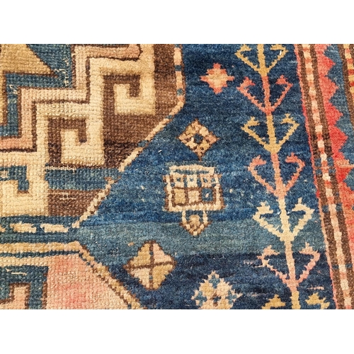 1157 - A Caucasian rug, having three central medallions, with star decoration to borders, 175 x 139cm.... 