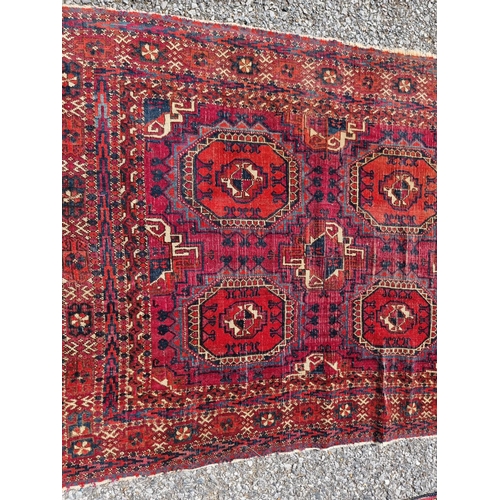 1158 - A small Persian rug, having repeated decoration to central field; together with a Persian bag face, ... 