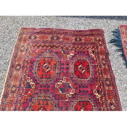 1158 - A small Persian rug, having repeated decoration to central field; together with a Persian bag face, ... 