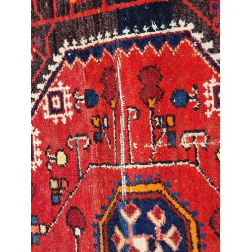 1159 - A Persian rug, having allover geometric design, with floral borders, 227 x 149cm.