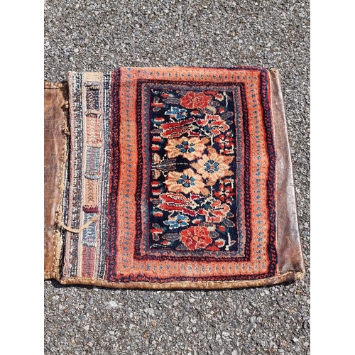 1163 - An old Persian saddle bag, 108 x 47cm.