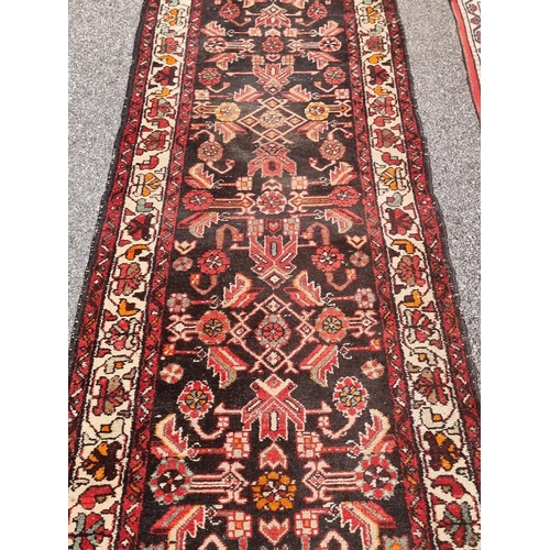 1164 - A Persian runner, having floral central field; together with a small Persian rug, having three centr... 