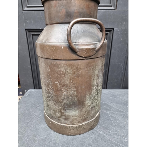 1318 - A vintage milk churn and cover, 49cm high.