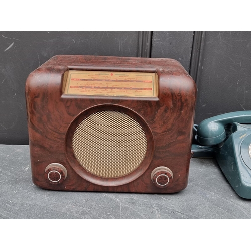 1340 - A Bush brown Bakelite radio; together with an old telephone. (2)