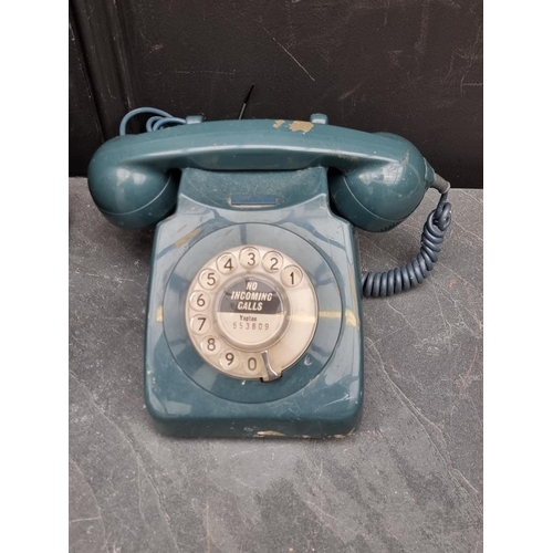 1340 - A Bush brown Bakelite radio; together with an old telephone. (2)