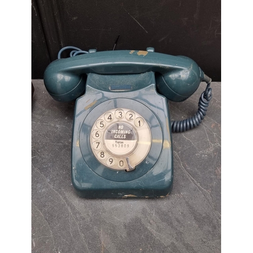 1340 - A Bush brown Bakelite radio; together with an old telephone. (2)