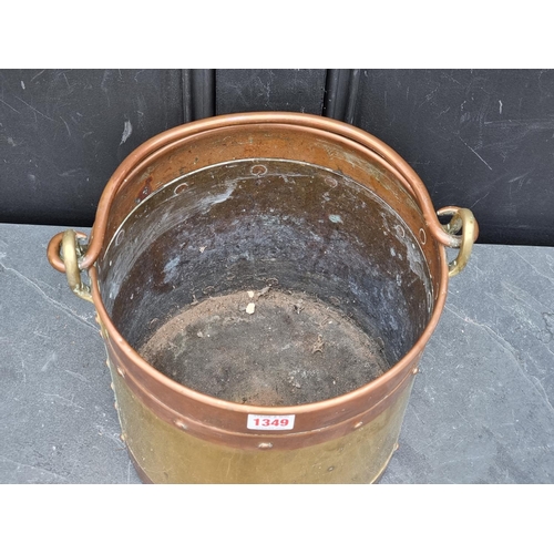 1349 - A copper and brass swing handled bucket, 26.5cm diameter.