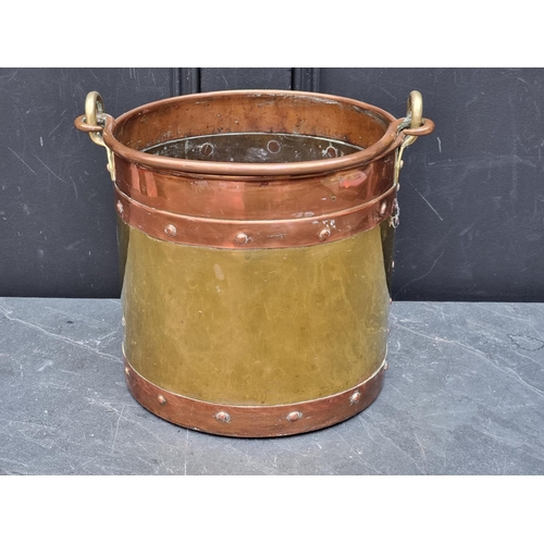 1349 - A copper and brass swing handled bucket, 26.5cm diameter.