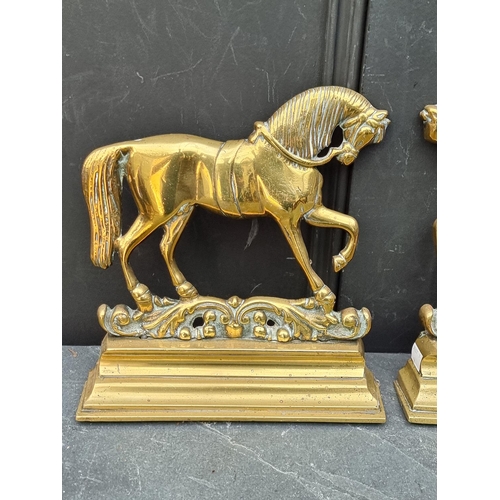 1356 - A pair of Victorian cast brass horse doorstops, 27cm high.