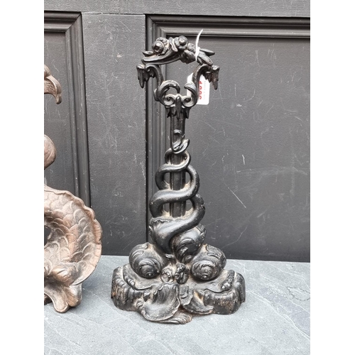 1366 - Two Victorian cast iron dolphin doorstops, largest 37.5cm high.