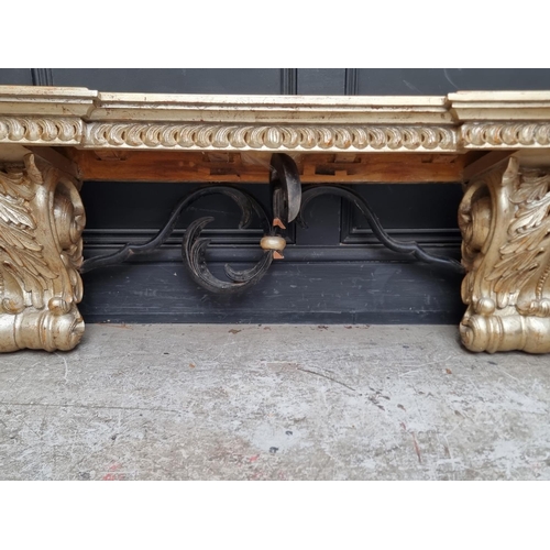 1375 - An 18th century style carved giltwood and ebonised shelf, 150cm wide, (s.d.).