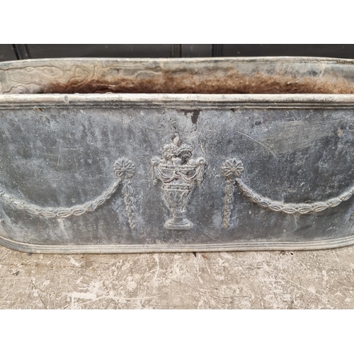 1377 - An old lead oval planter, 78cm wide.