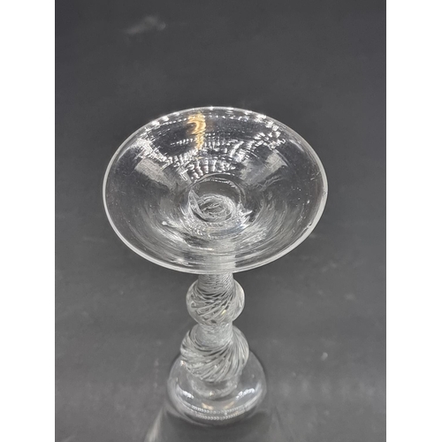 1389 - An 18th century air twist double knop wine glass, 17.7cm.