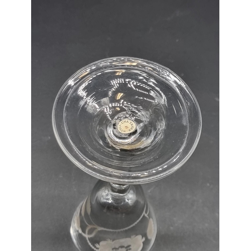 1392 - An 18th century Jacobite plain stemmed wine glass, the bowl finely engraved with a rose, bud an... 