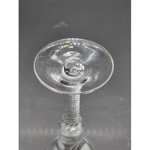 1395 - An 18th century Jacobite air twist wine glass, the bowl engraved with a rose, bud and leaves, 1... 