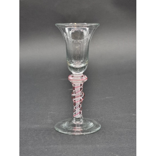 1397 - An 18th century Dutch red and white opaque twist wine glass, 15.1cm.