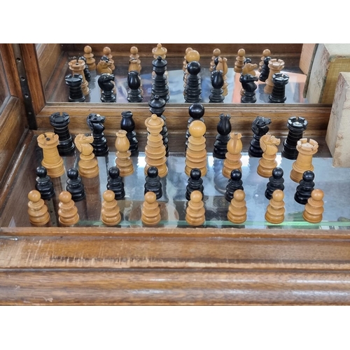 1405 - A boxwood and ebony chess set, king 8.1cm high, pawn 4cm high; together with another Staunton patter... 