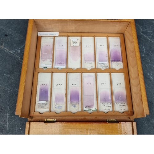 1423 - A cased set of haematology microscope slides; and other related items.