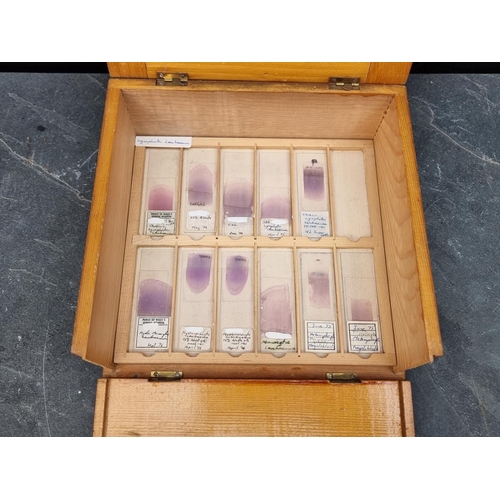 1423 - A cased set of haematology microscope slides; and other related items.