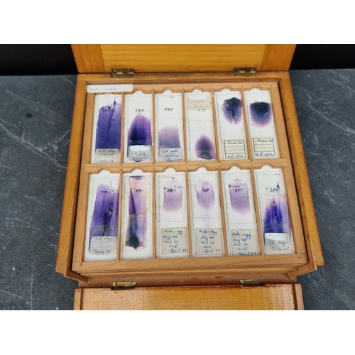 1423 - A cased set of haematology microscope slides; and other related items.