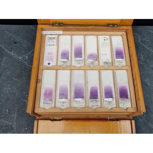 1423 - A cased set of haematology microscope slides; and other related items.