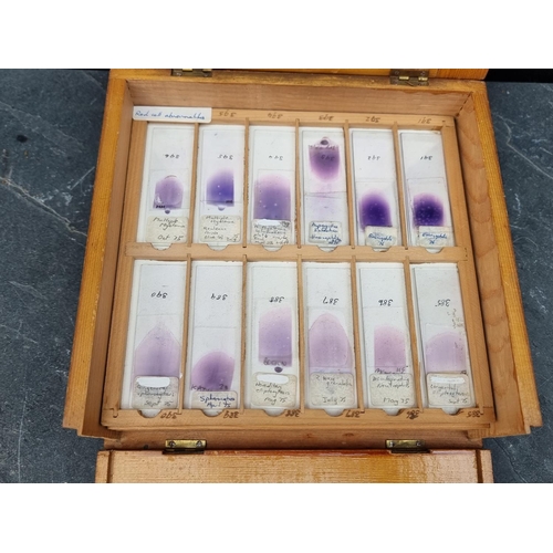 1423 - A cased set of haematology microscope slides; and other related items.