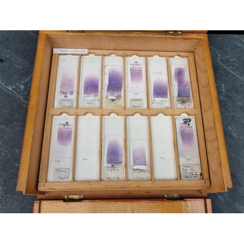 1423 - A cased set of haematology microscope slides; and other related items.