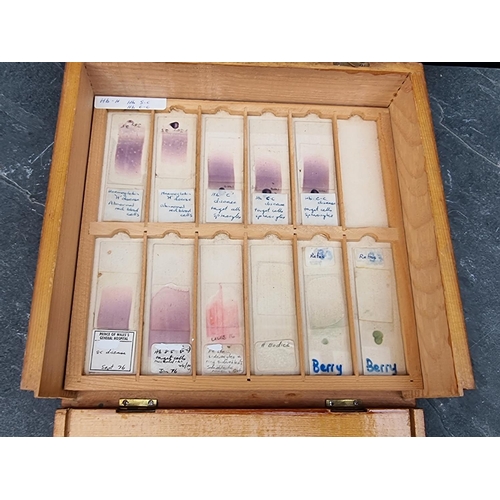 1423 - A cased set of haematology microscope slides; and other related items.