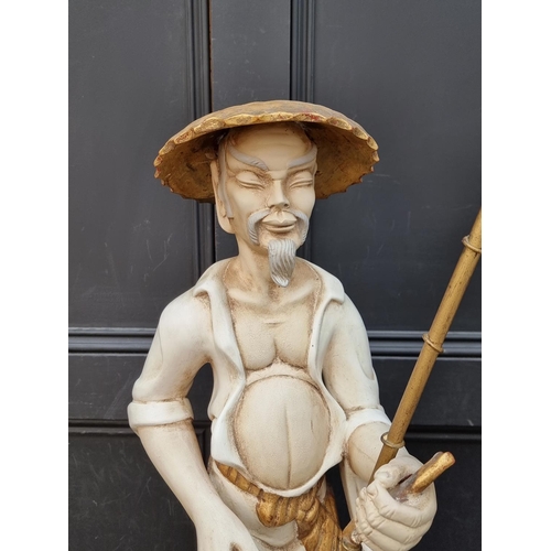 1441 - A large plaster figural table lamp, 87cm high.