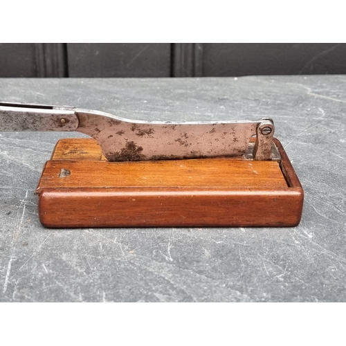 1447 - A Victorian tobacco cutter, labelled 'Samuel Bradford...', 22cm long.