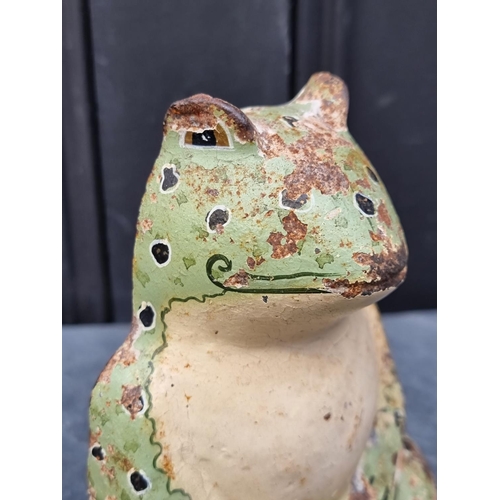 1451 - A polychrome painted cast iron frog doorstop, 16cm high.