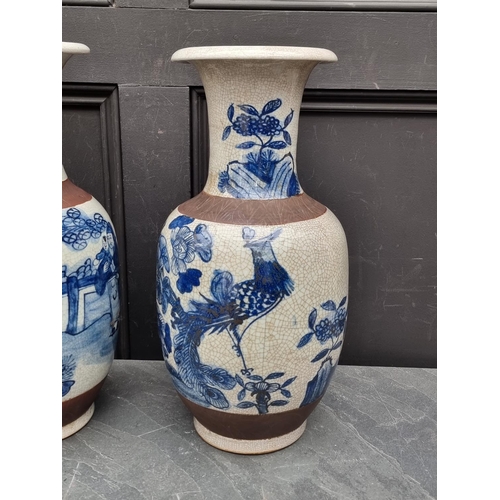 1462 - A pair of Chinese blue and white crackle glaze vases, 44.5cm high.