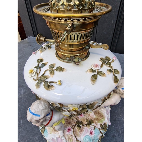 1494 - A Plaue porcelain oil lamp, chips and cracks to bowl, height excluding chimney 34cm.... 