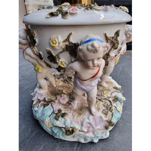 1494 - A Plaue porcelain oil lamp, chips and cracks to bowl, height excluding chimney 34cm.... 