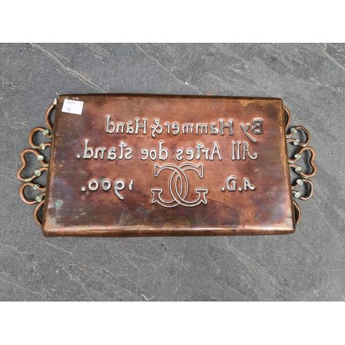 1511 - An Arts & Crafts copper twin handled tray, embossed with the motto of the Worshipful Company of ... 