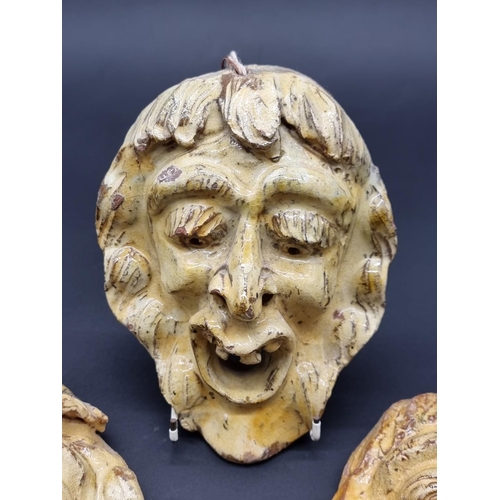 1513 - Studio Pottery: a set of three wall masks, largest 22.5cm high.