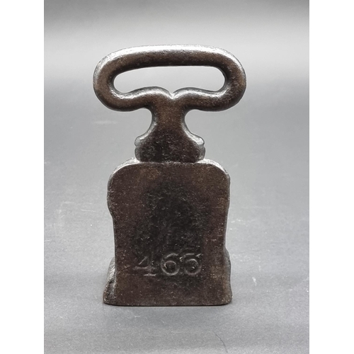 1523 - A Victorian cast iron hairy paw doorstop, 17cm high.