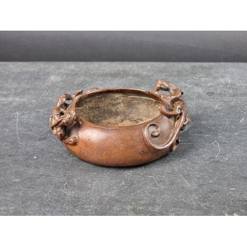 1538 - A Chinese bronze twin handled censer, archaistic seal mark to base, with chilong handles, 12cm wide.... 