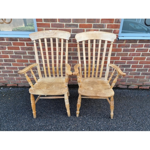 1054 - A pair of antique beech and elm lath back kitchen armchairs.En suite with the next lot.... 