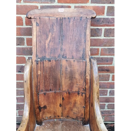 1058 - A 19th century ash, elm and fruitwood lambing type chair.