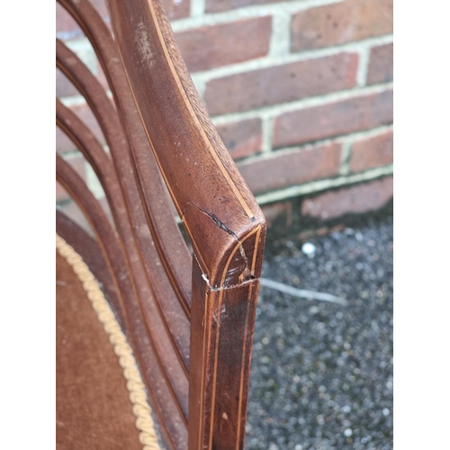 1059 - A circa 1900 mahogany and inlaid salon tub chair.