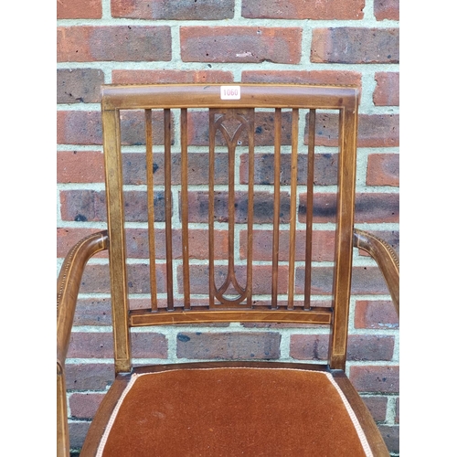 1060 - An Edwardian mahogany, chequer and line inlaid elbow chair.