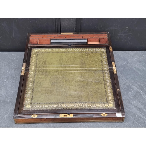 1109 - A Victorian figured walnut and brass writing slope, baring plaque inscribed 'Mr James P McPhie,... 