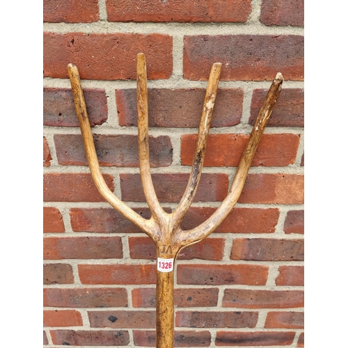 1326 - A vintage beech hayfork, with branded initials, 143cm long.