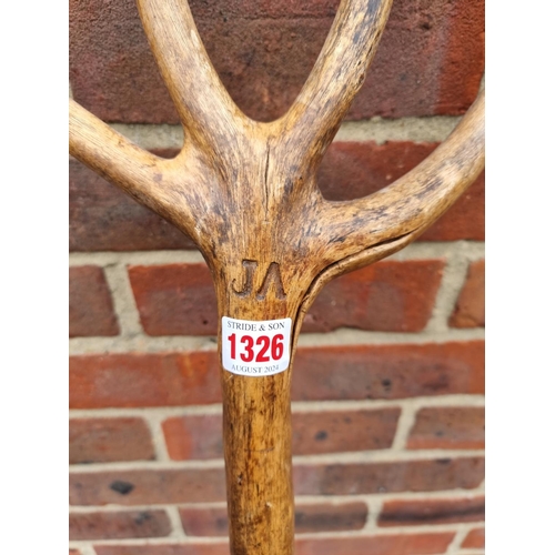 1326 - A vintage beech hayfork, with branded initials, 143cm long.